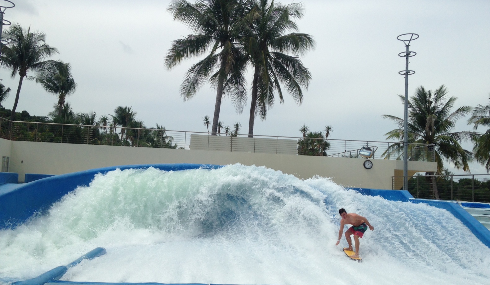 A man tries to get higher waves on a flowrider