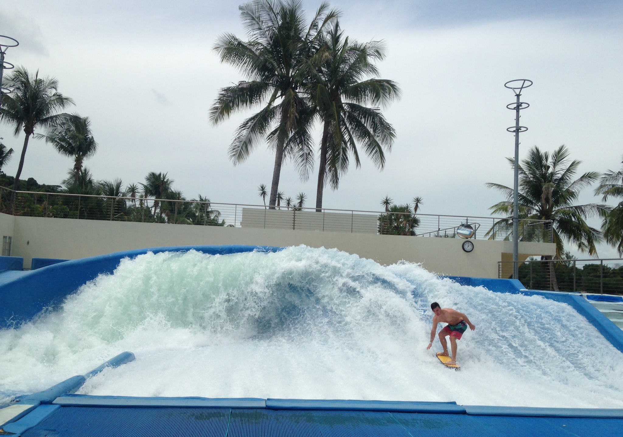 A man tries to get higher waves on a flowrider