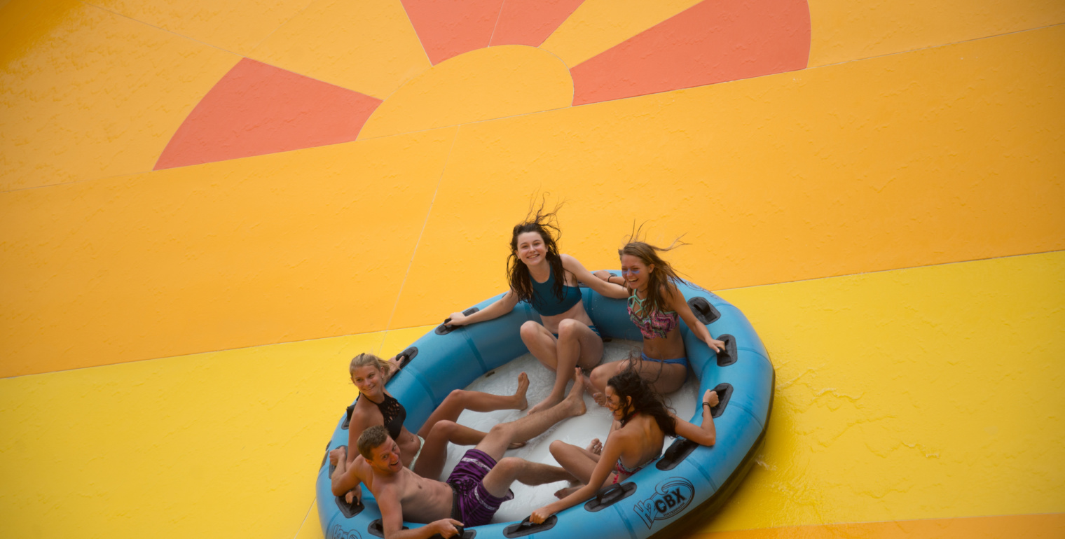 One man and three woman are on the top of manta