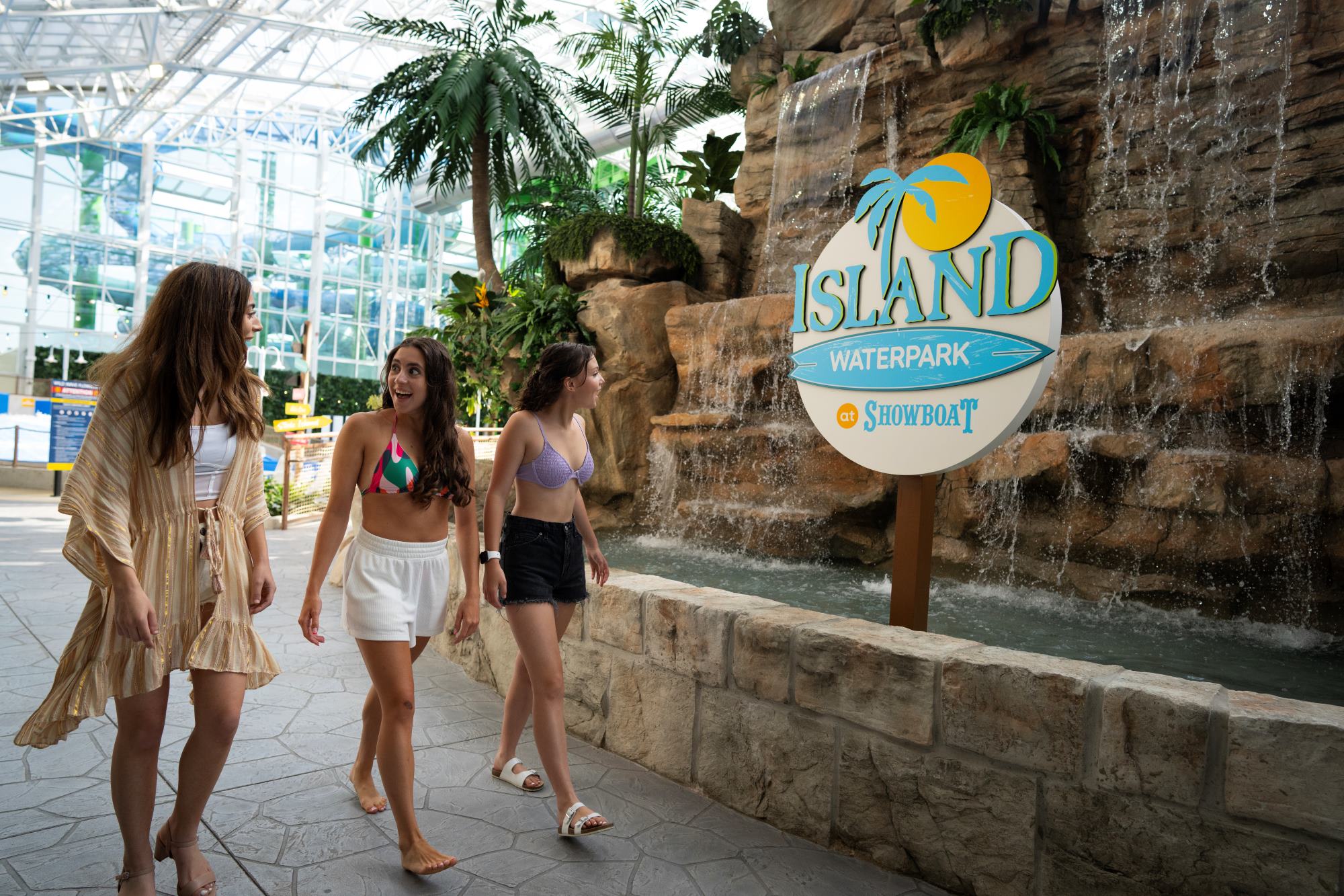 Three women walking inside indoor water park