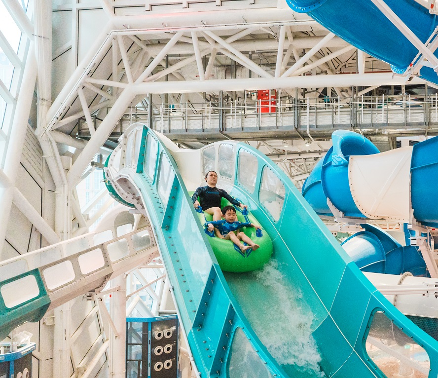 Man on an inner tube on a water coaster