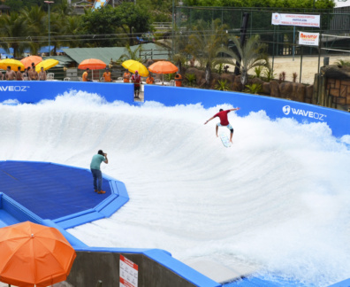 The man in red is showing off his skills in waveoz